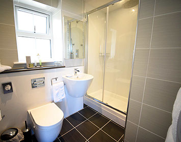 En Suite Shower Rooms with Electric Towel Rails Anti Steam Mirrors at Heatherfield House