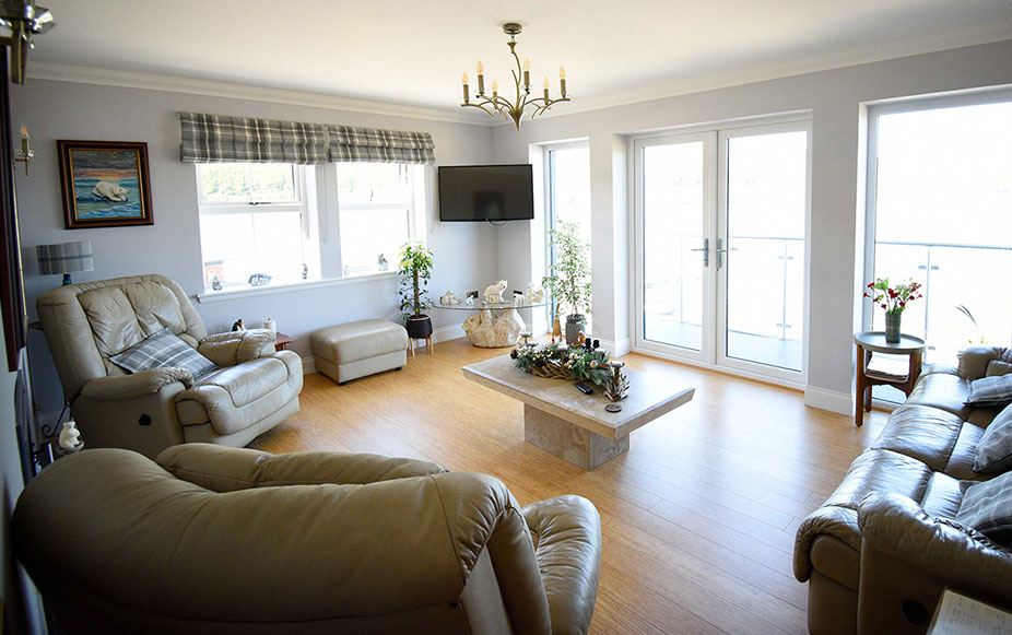 Stay in a comfortable guest living room at Heatherfield House Bed and Breakfast Accommodation near Portree