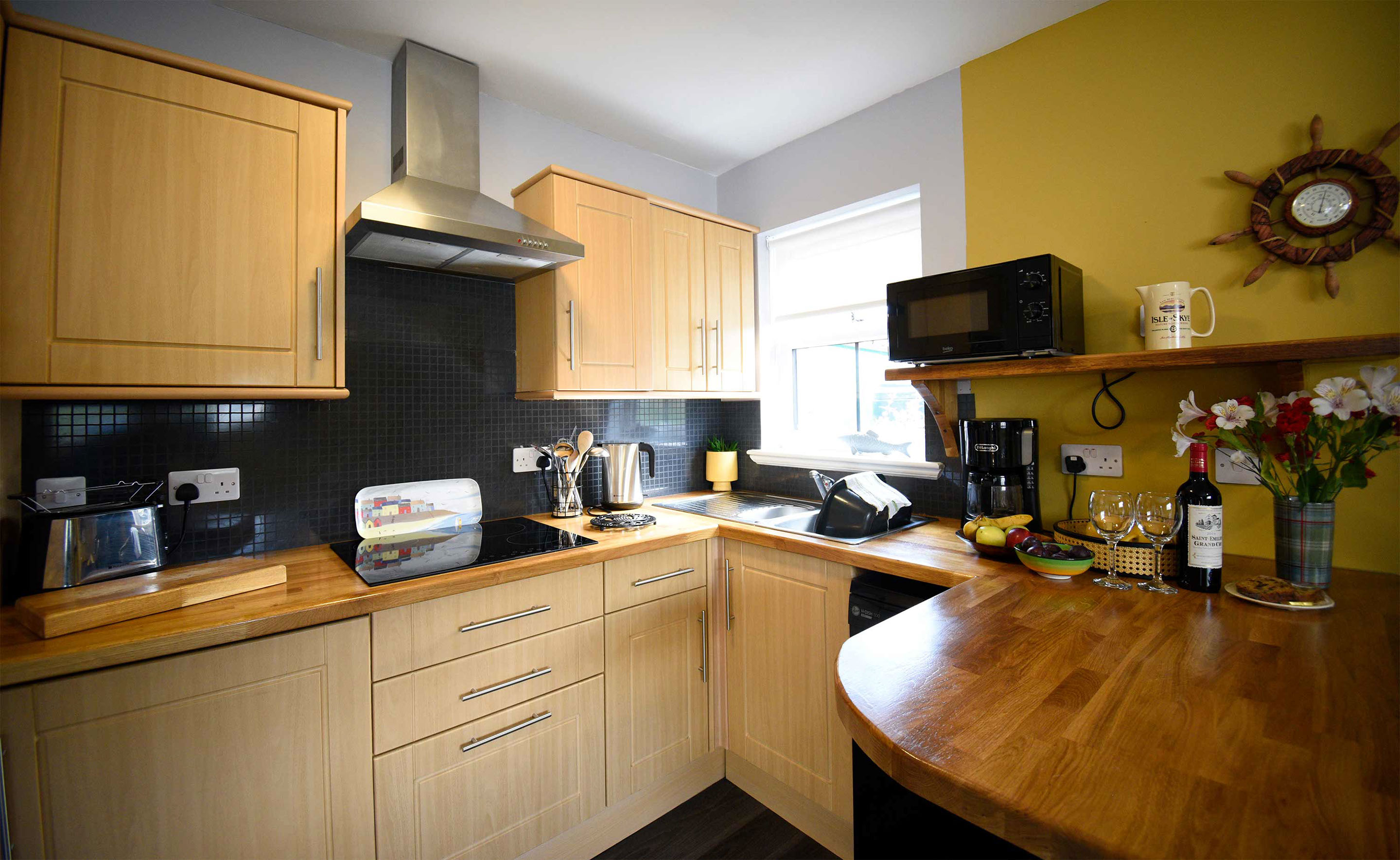 Heatherfield House Self Catering Accomodation near Portree contains a Modern Kitchen with Oven Hob Microwave and Dish Washer