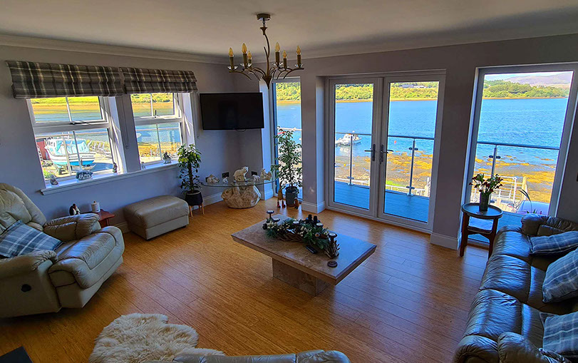 Heatherfield House features a sea view living room with comfortable seating Widescreen TV and WIFI Internet access 