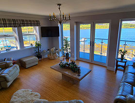 Heatherfield House features a sea view living room with comfortable seating Widescreen TV and WIFI Internet access 